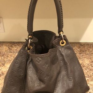 Louis Vuitton Artsy brown purse.